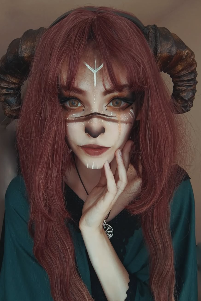 Mystical rune makeup with metallic fantasy eye details