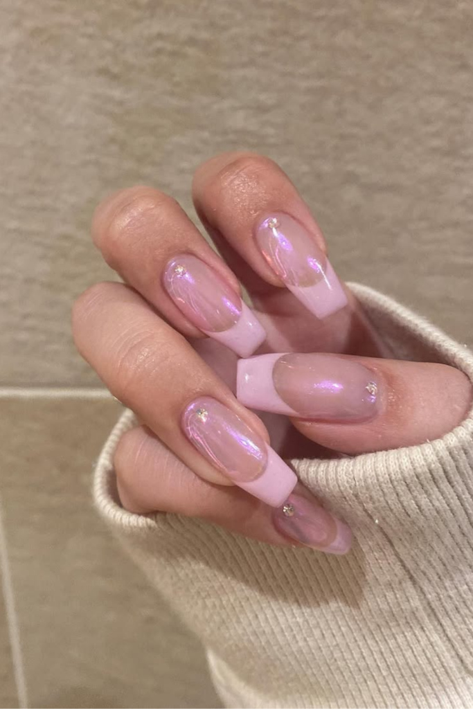 Sheer pink manicure with classic white tips
