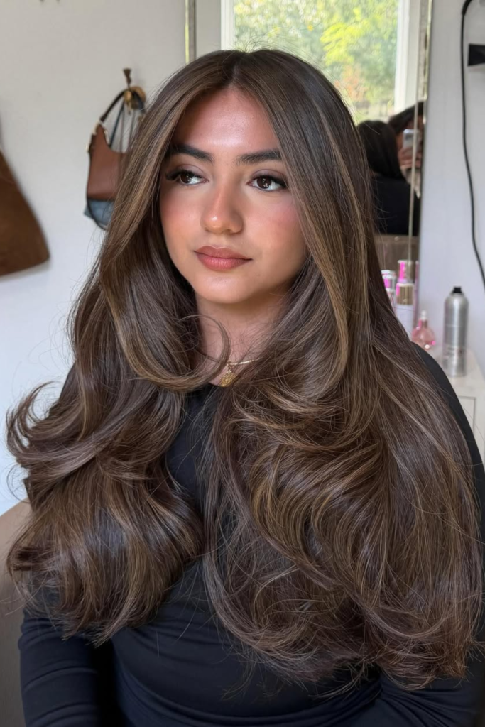 Smoky honey brunette hair with warm ribbons