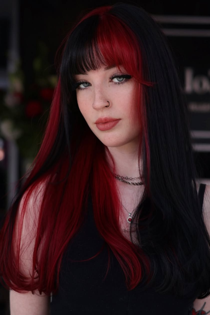 Split dye black and red dramatic hair color look