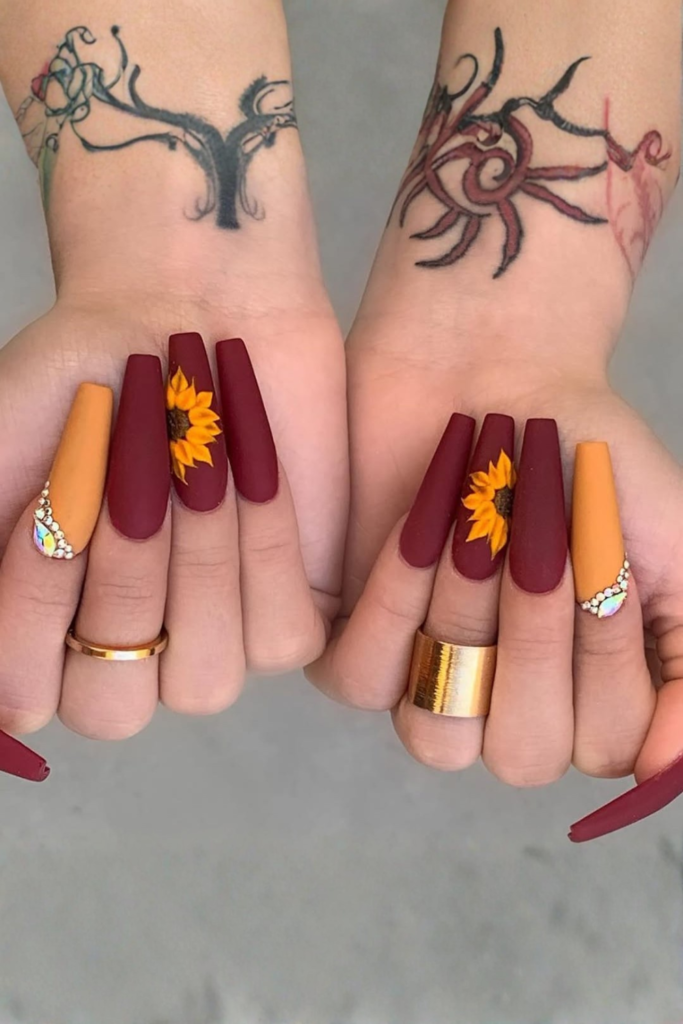 long coffin acrylic nails with detailed sunflower art