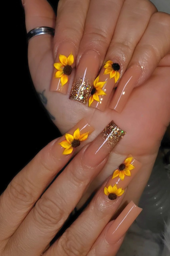 glitter fade nails with sunflower design subtle shimmer