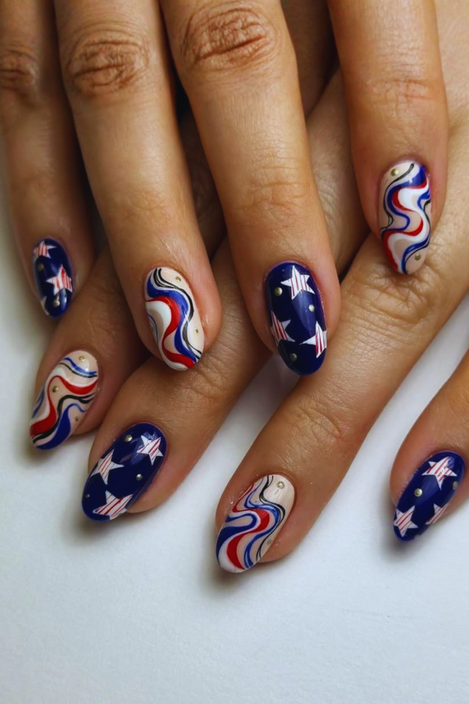 Red white blue swirl nails with modern summer manicure design