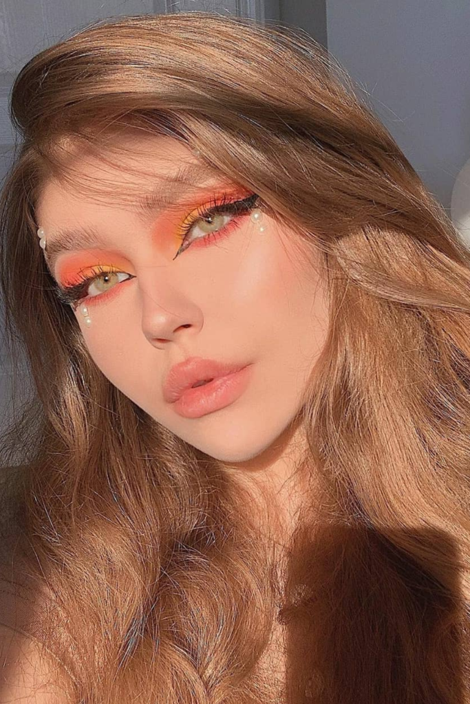 Sunset shimmer makeup with bronze eyes and glossy nude lips