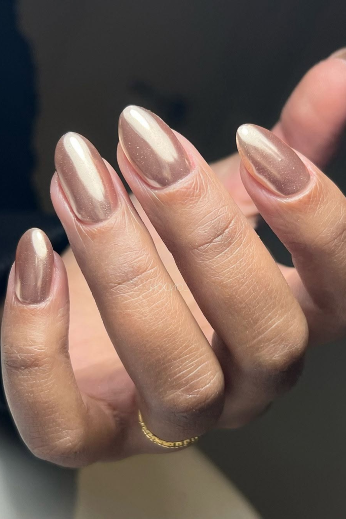 Champagne chrome nails with subtle shimmer