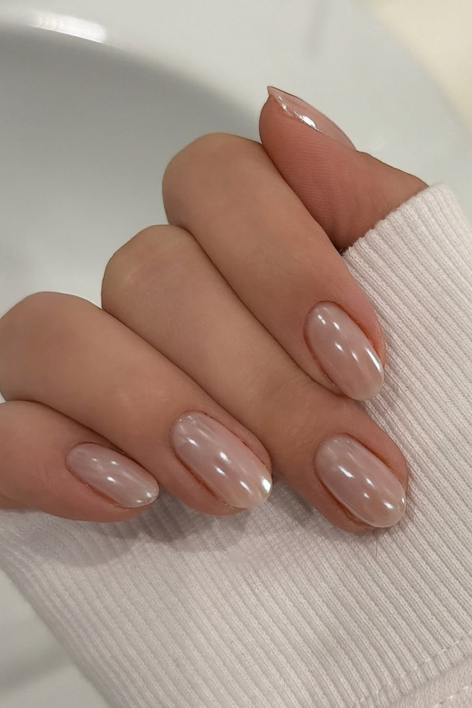 Glazed nude nails with reflective finish