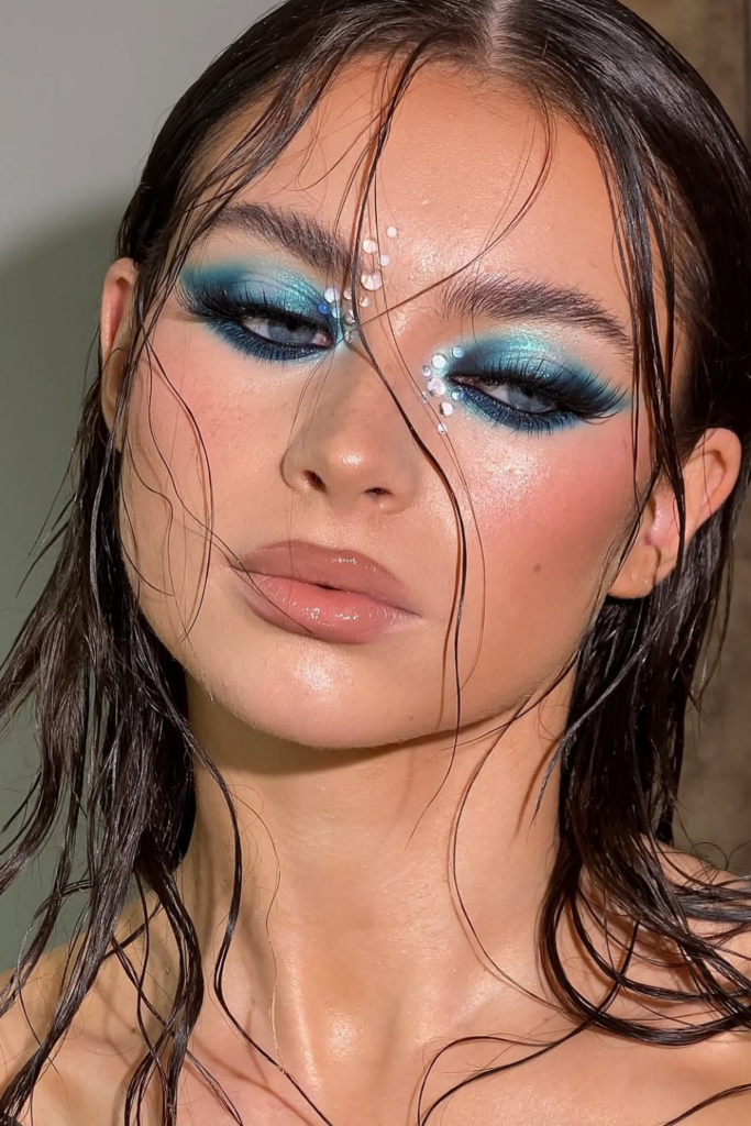 Blue summer eye makeup with soft shimmer accents