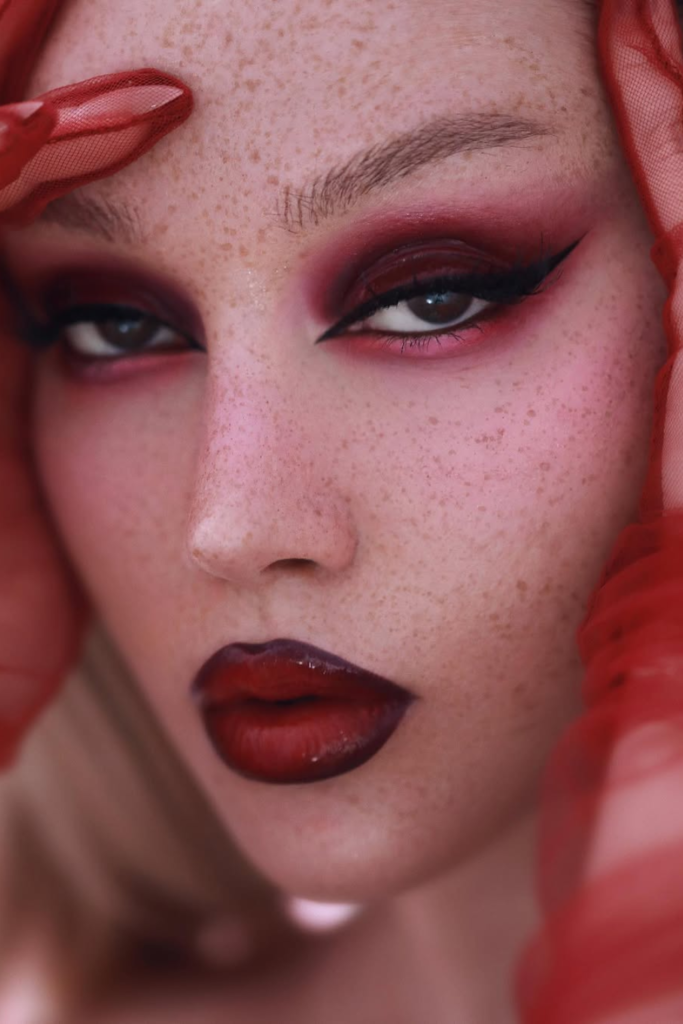 Cherry cola makeup with glossy berry lips and bronze eyes