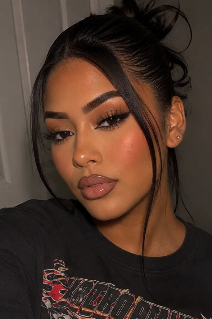 Sunkissed glam makeup with warm bronzer and glossy lips