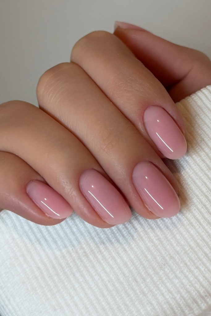 Lip gloss nails with shiny nude pink manicure