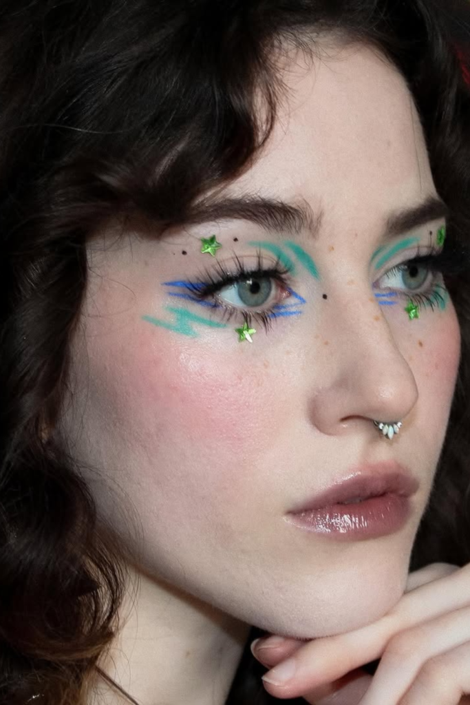 Celestial eye makeup with star-inspired liner details and cosmic accents