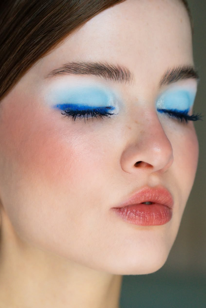 Icy blue eyeshadow with glowing skin