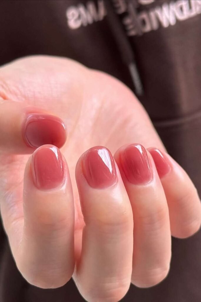 Jelly pink short nails with glossy finish