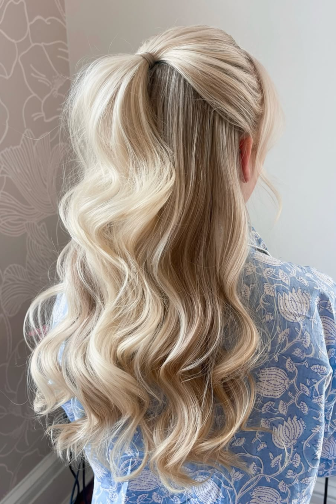 Half-up hairstyle with soft flowing curls