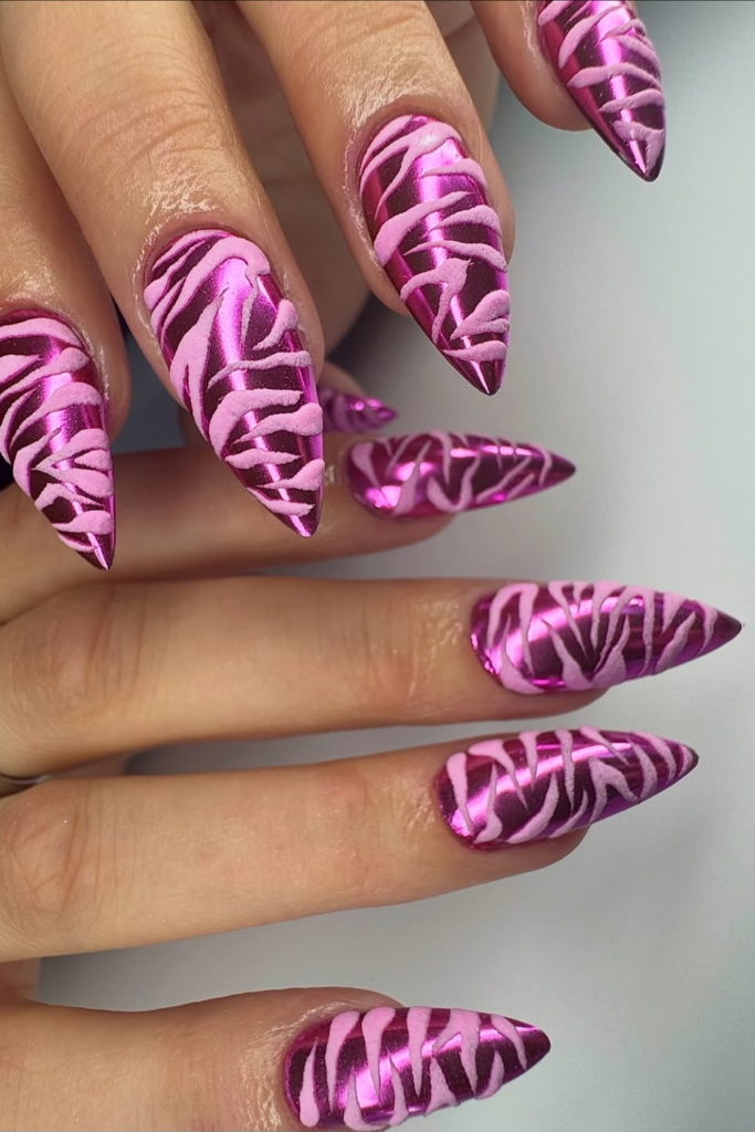 Chrome animal print manicure with glossy black and silver stripes