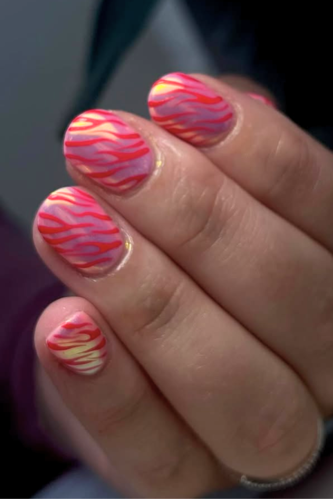 Pink chrome manicure with stylish animal print details
