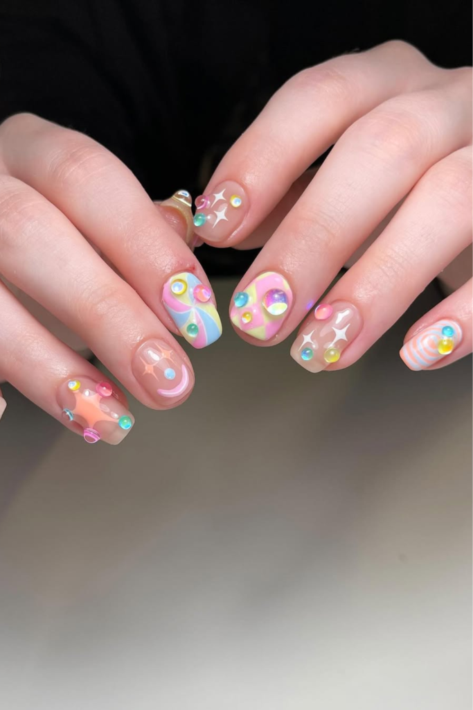 3D sculptural manicure with raised gel nail art details