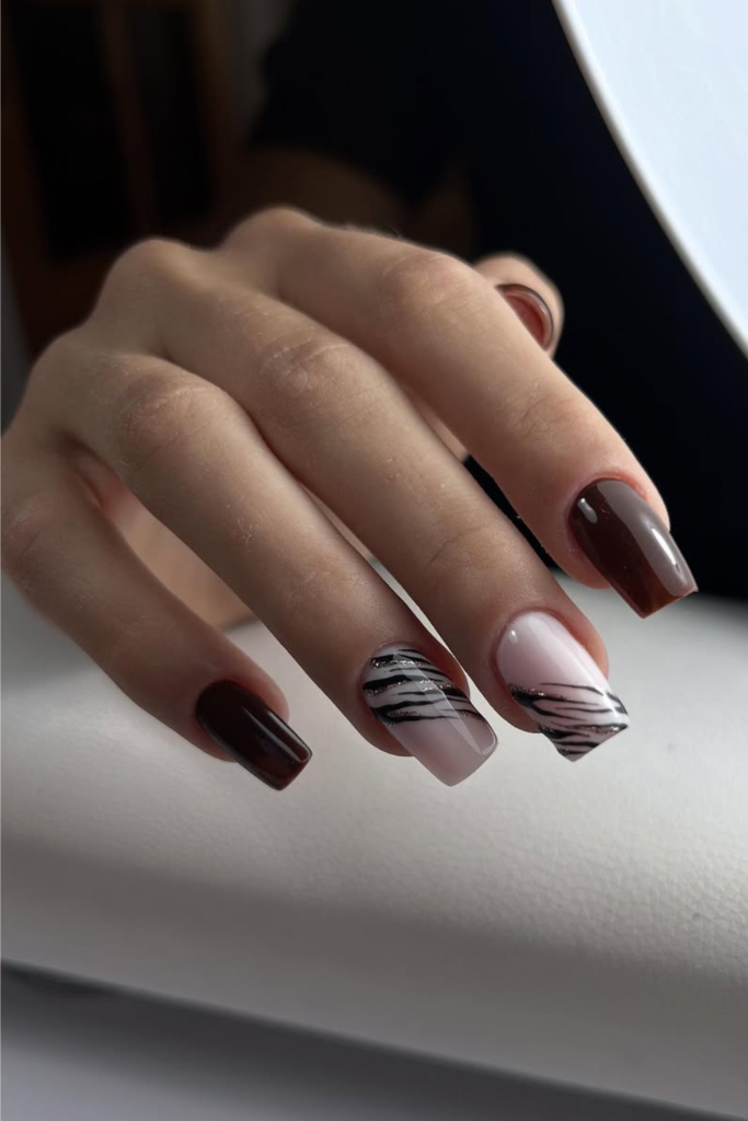 Chocolate brown manicure with chic animal print accents