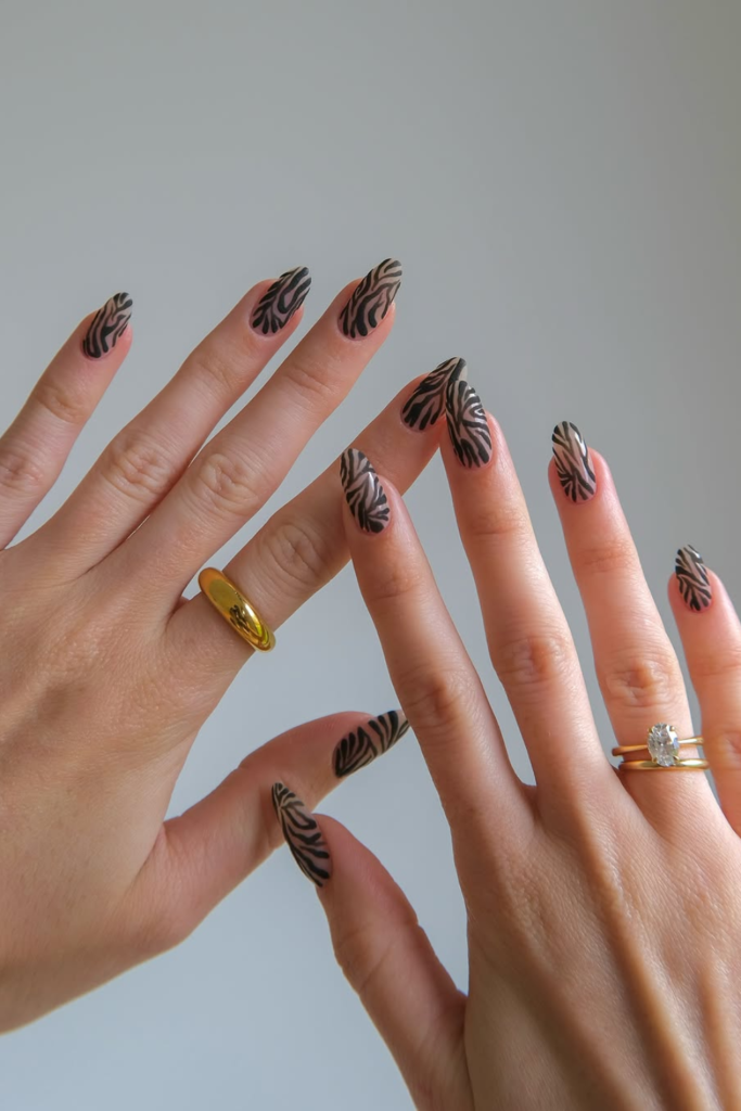 Almond-shaped animal print nails with elegant glossy finish