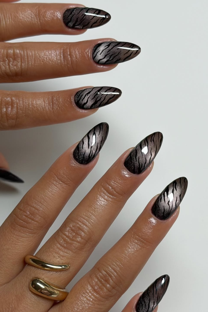 Cat eye magnetic manicure with striking zebra-inspired design