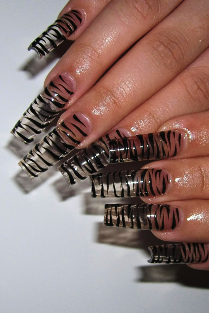 Glazed animal print nail design with a glossy pearl finish