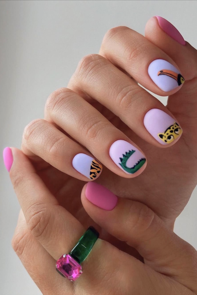 Luxury safari-inspired manicure featuring mixed animal print nail art
