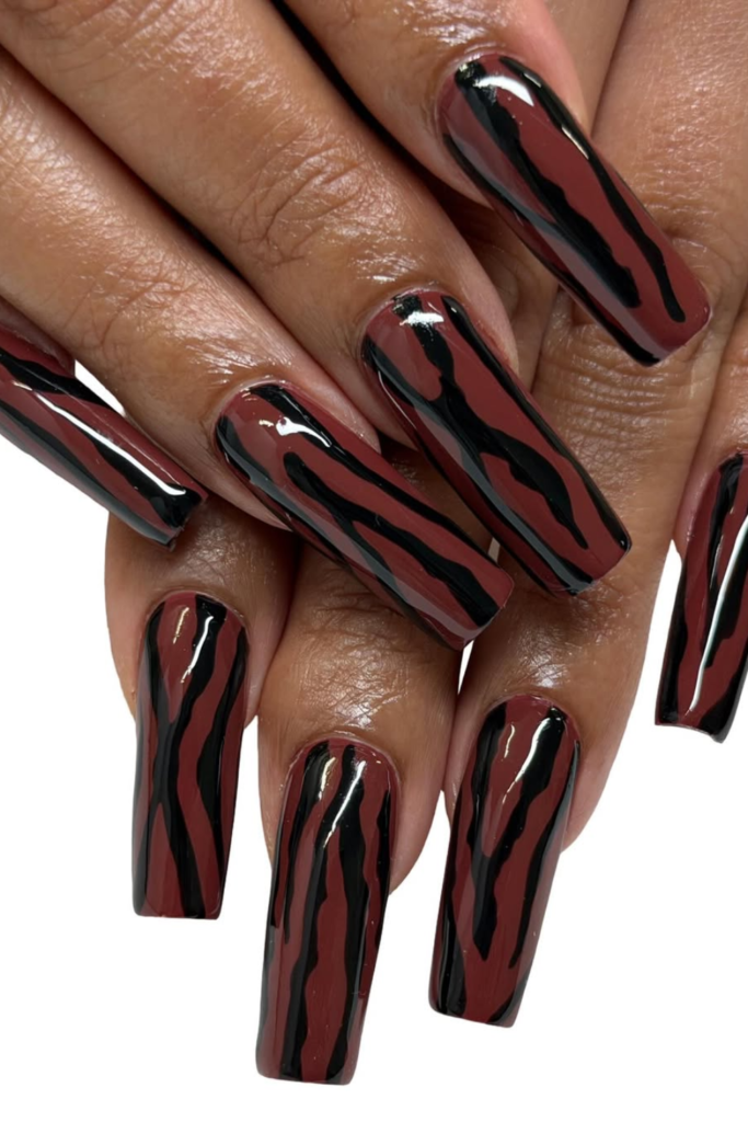 Old money inspired manicure with elegant zebra pattern accents