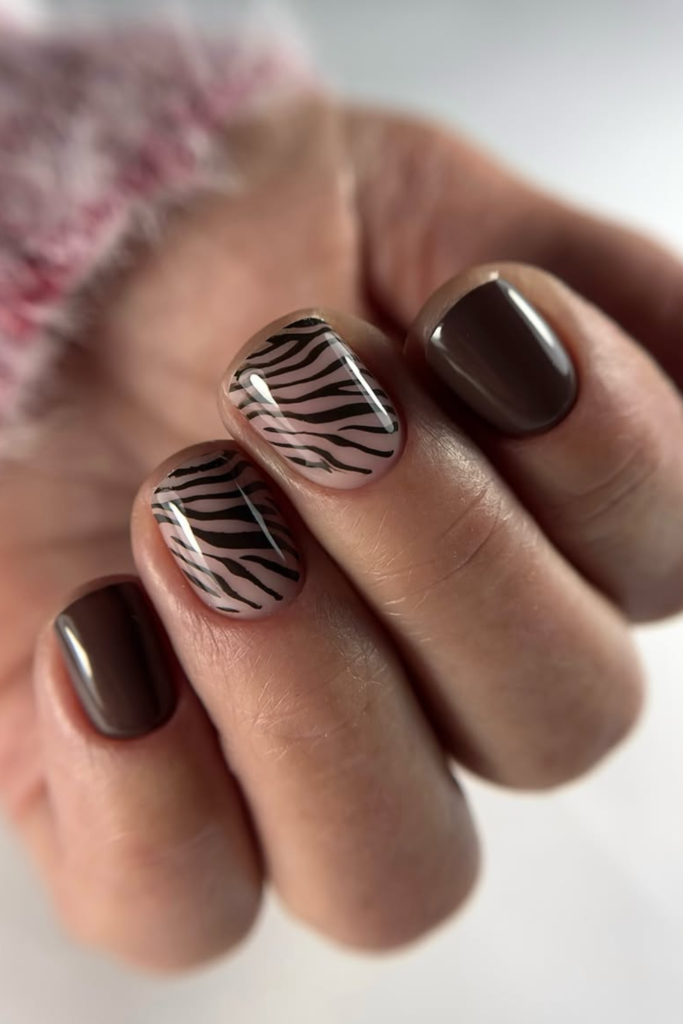 Mocha brown animal print manicure with soft neutral stripes