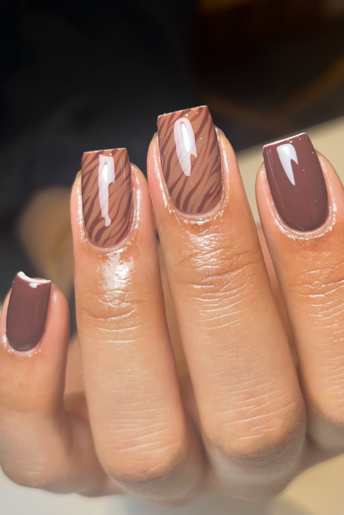 Espresso brown nail art with modern zebra-inspired accents