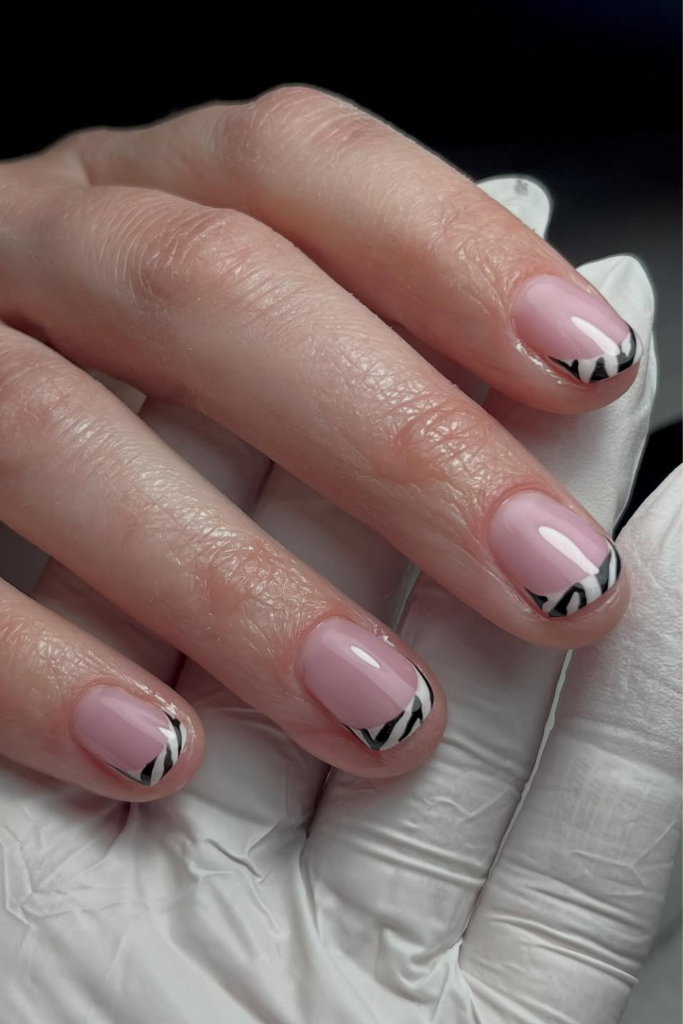 French tip manicure with delicate zebra stripe details