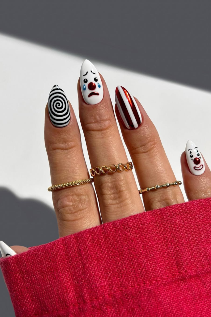 Chrome manicure with bold artistic nail design and mirror finish