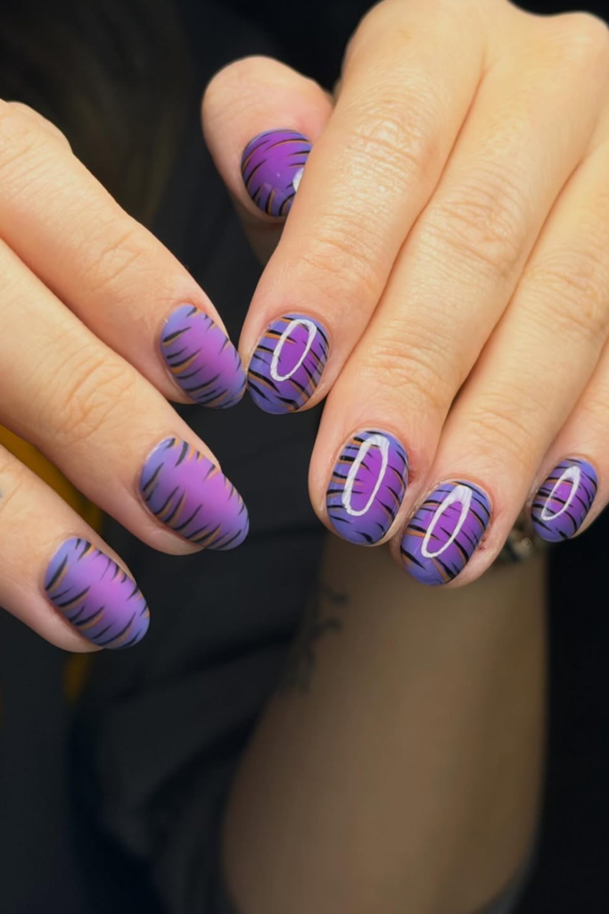 Aura manicure with subtle animal print accents and soft gradients